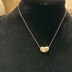 Elsa Peretti® Bean® Design pendant by Tiffany & Co.. 👝